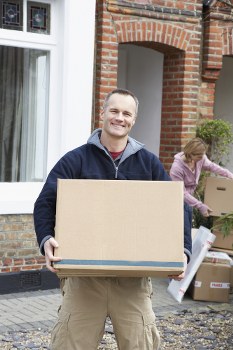 Furniture pick-up service removing a sofa in Westkensington