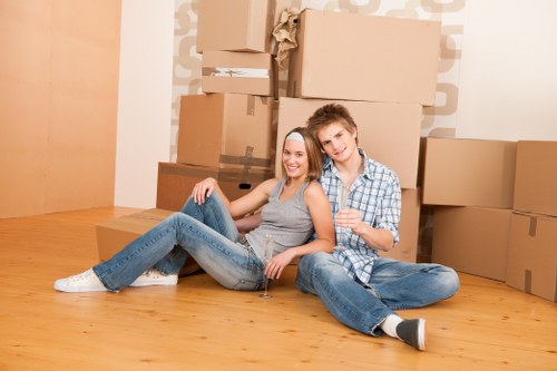 Packed boxes and furniture ready for removals in a West Kensington flat