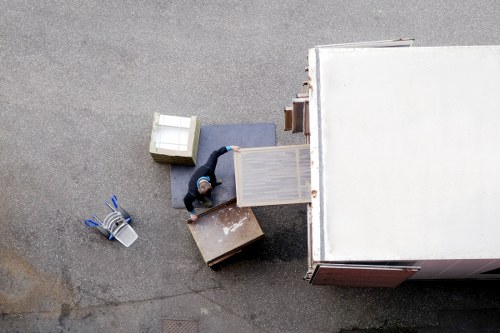Professional home movers transporting household items across West Kensington
