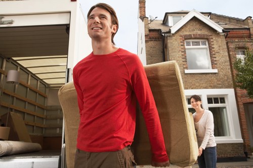 Residential street scene showing local house removals in Westkensington