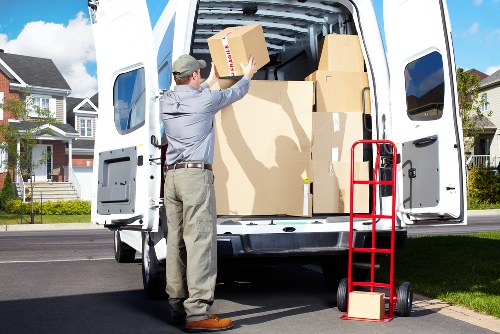 Loading furniture into a moving truck near West Kensington streets