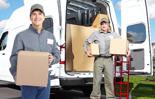 Professional movers loading furniture for urgent West Kensington relocation