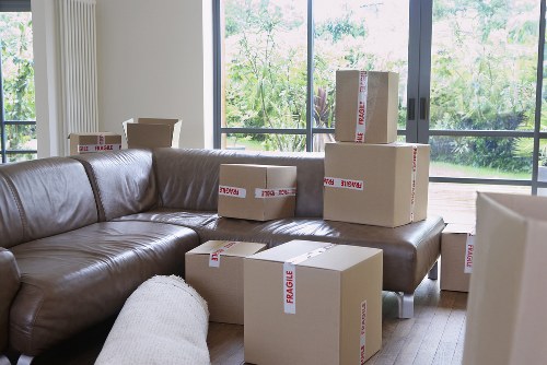 Recycling bins and sorted packing materials representing sustainable moving practices